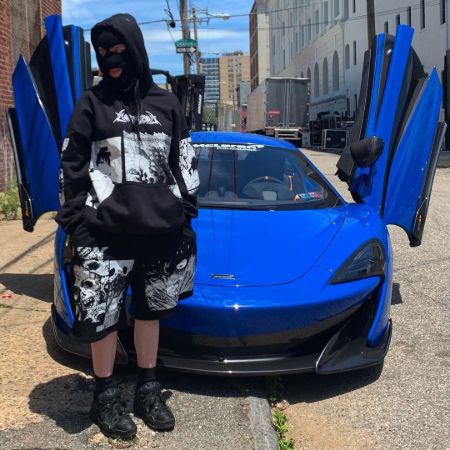 Billie Eilish posing in front of McLaren 720S.